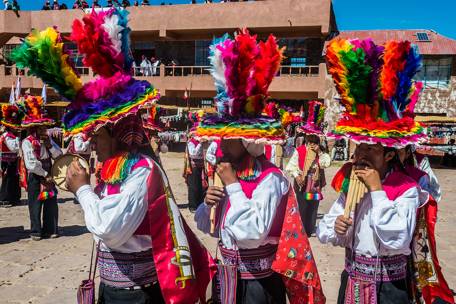 Musicians and dancers in the peruvian Andes at Taquile Island on Puno Peru 