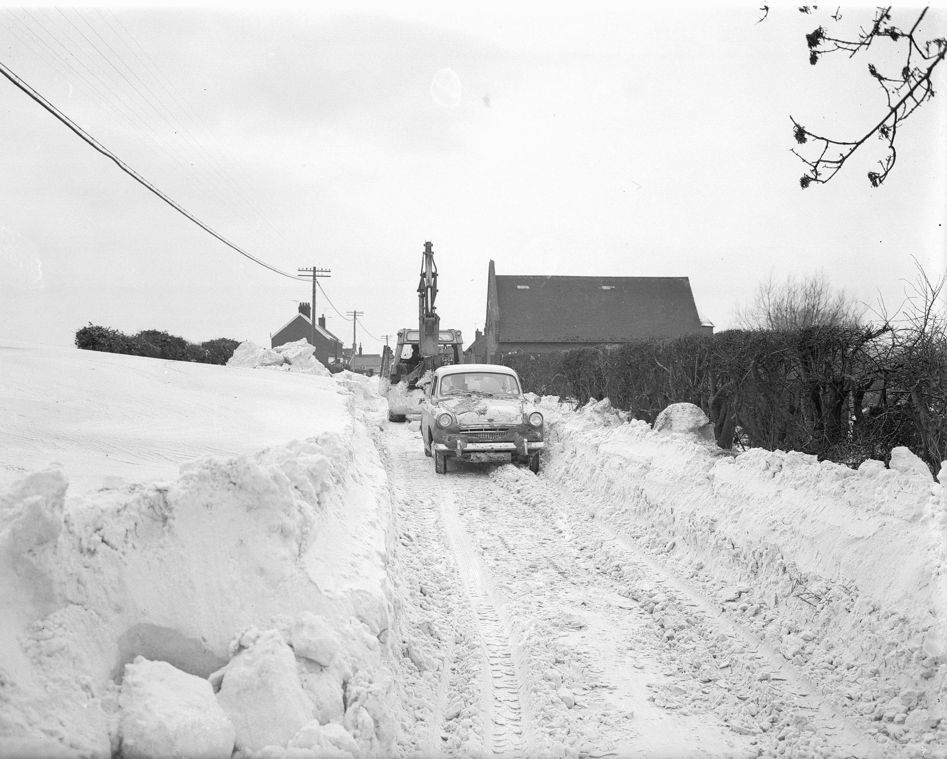 Snow blocking the Wroxham to Potter Heigham road at Ludham during the frozen winter of 1963.