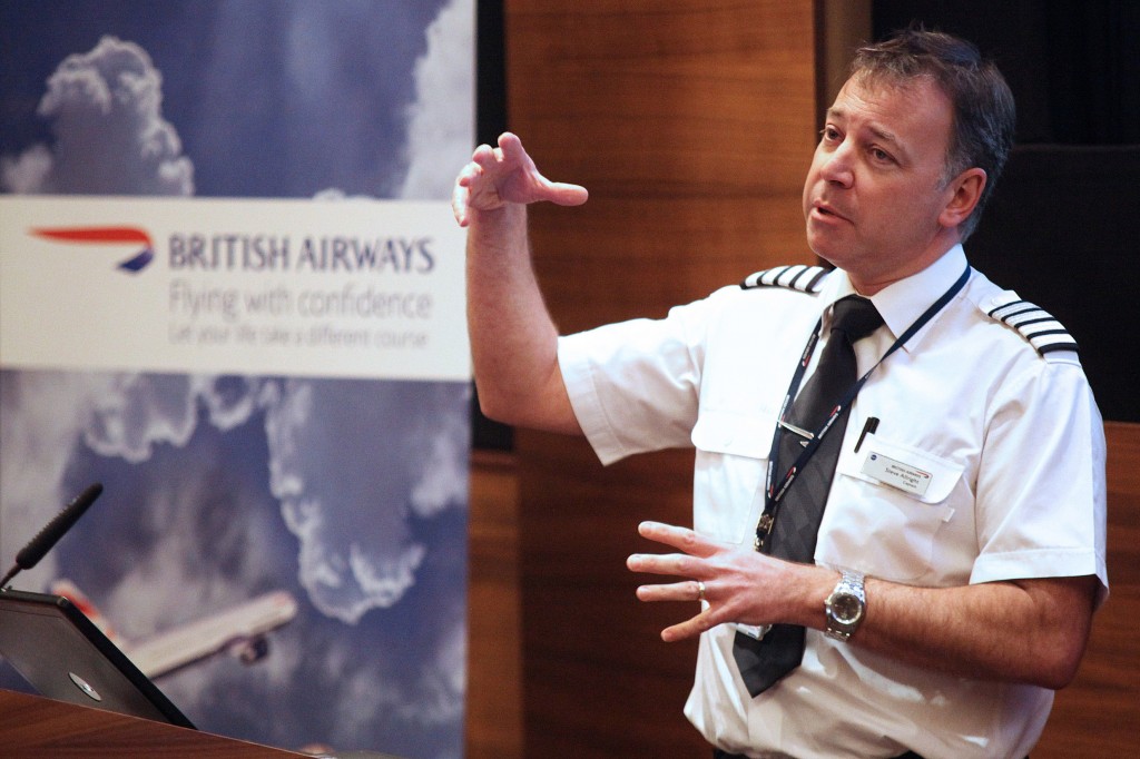 Captain Steve Allright talks to passengers during the Flying With Confidence course