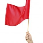 Hand waving a red flag